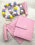 Baseball and softball themed wristlet with wallet and keychain in pink