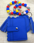 Baseball and softball themed wristlet with wallet and keychain in red and blue