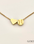 Product close up picture for the Heart and Baseball charm necklace in gold
